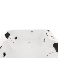 Acercamiento al sistema de hidromasaje de la tina Dublín, con jets direccionales y minijets lumbares para masaje relajante.